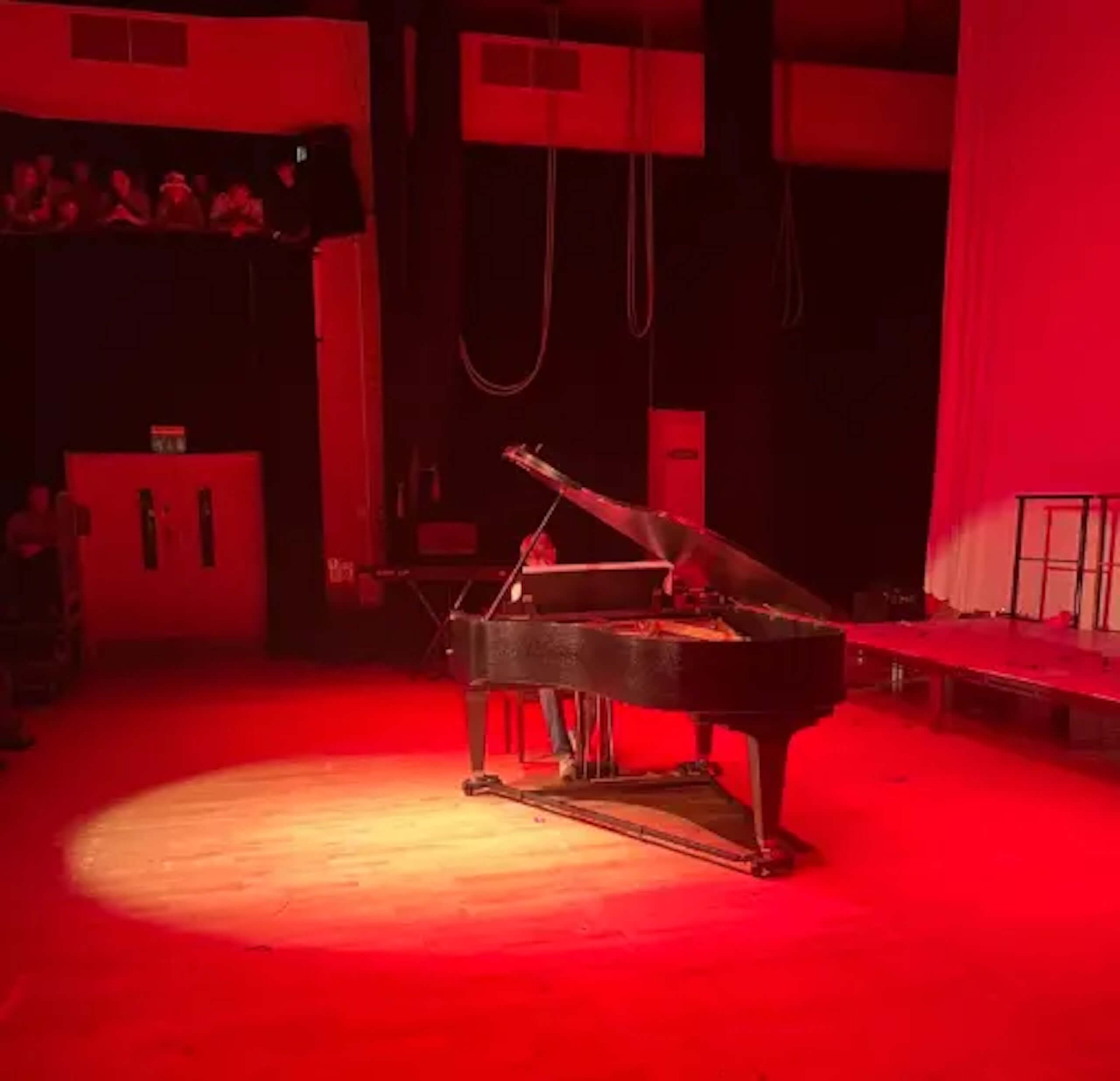 Pocklington pupil playing on the piano on the stage