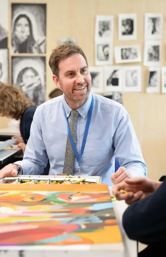 Pocklington School teacher talking to Sixth Former in art room