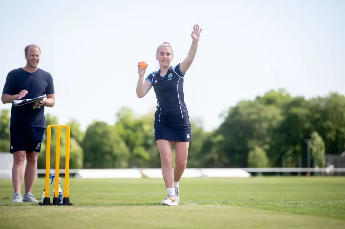 Pocklington School pupil bowling a cricket ball