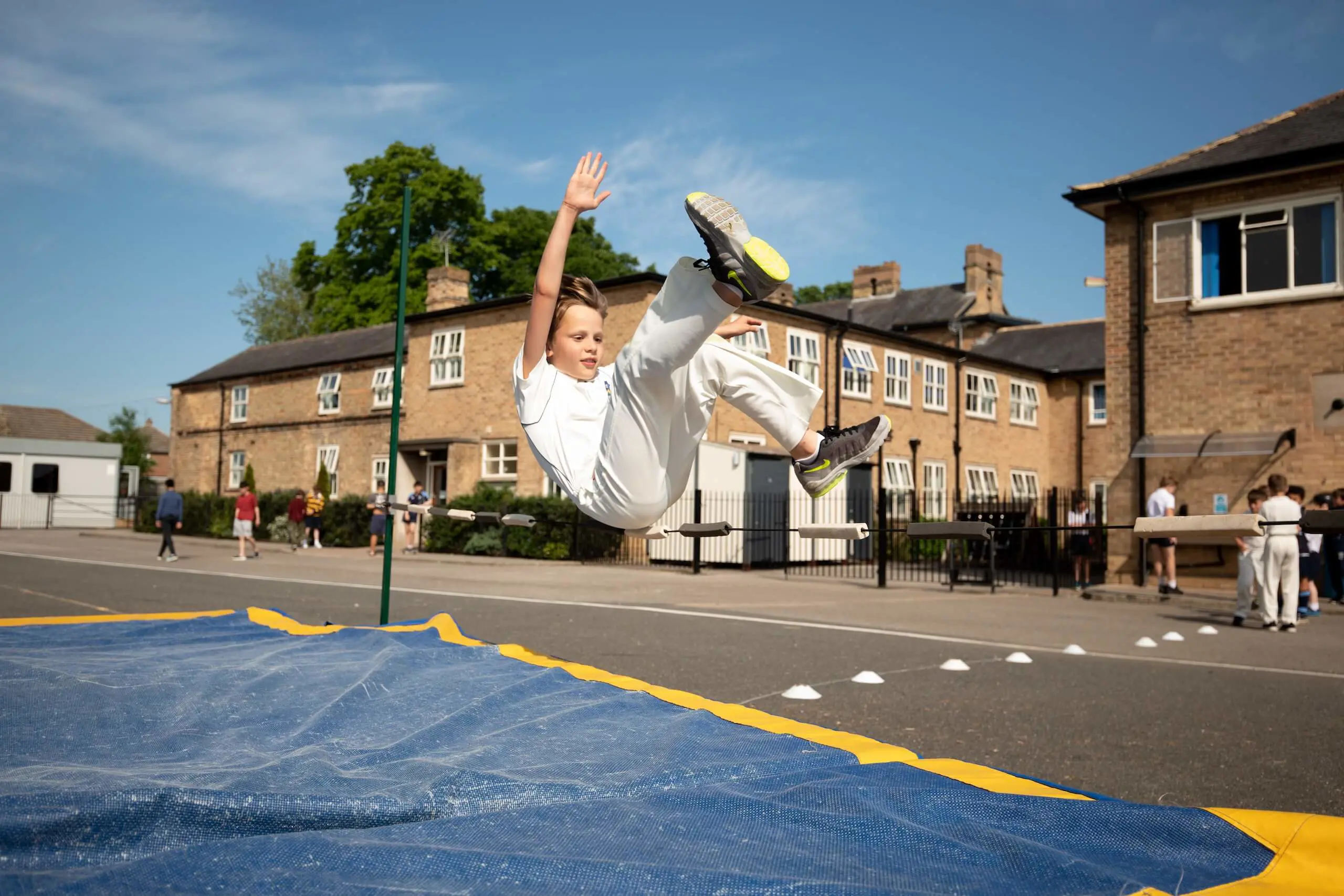 Pupil practises the high jump in sport at Pocklington Prep School a top private day and boarding school in Yorkshire near York, Beverley and Hull