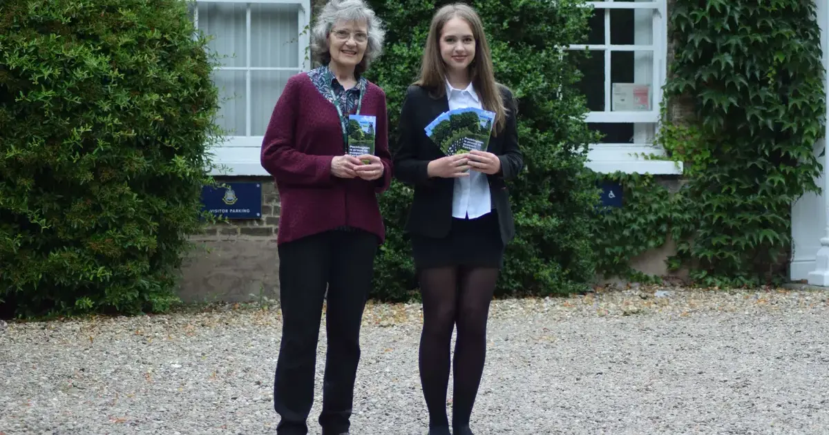 Polina and Judith with Fairtrade leaflet outside Pocklington SchoolPage Image