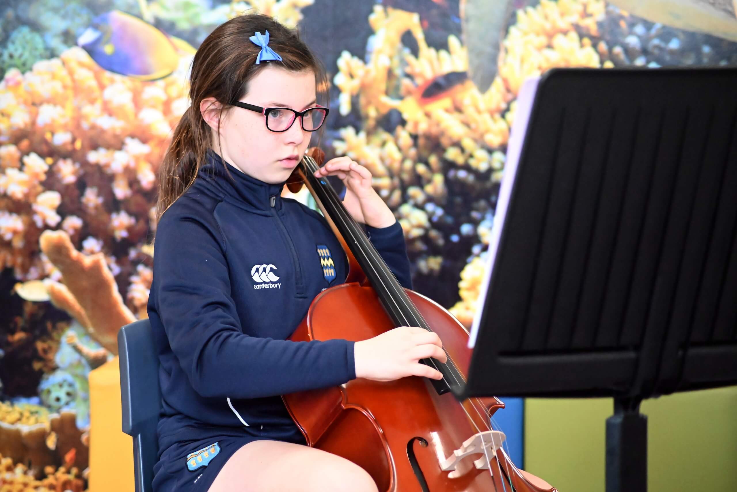 Pupil learning to play cello Pocklington Prep School a private day and boarding school for boys and girls in Yorkshire near York, Hull and Beverley