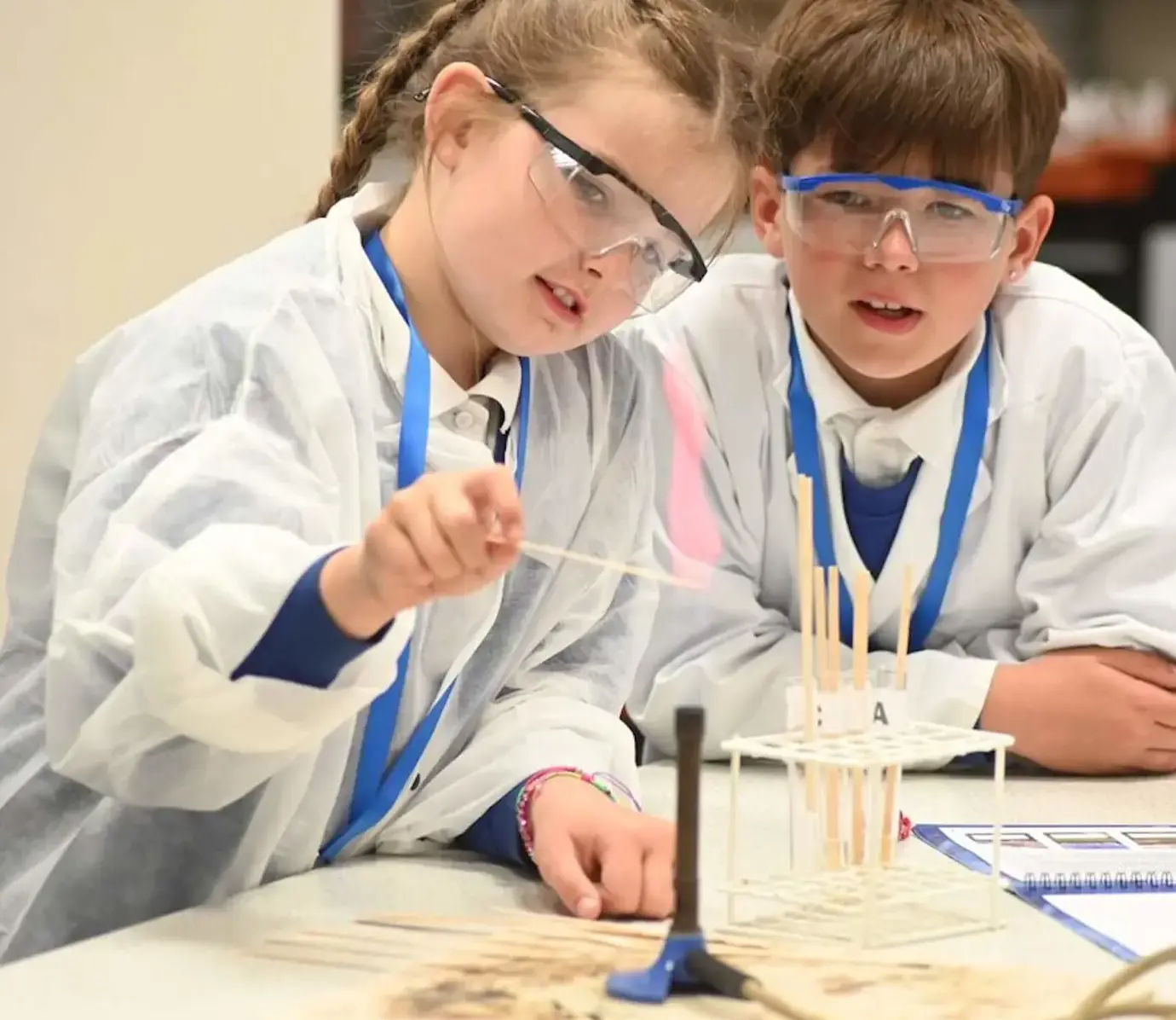 Primary school pupils with test tubes at Pocklington School’s CSI Science Day